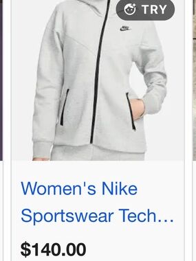 This heather grey Nike Sportswear Tech Fleece Windrunner hoodie features a full-